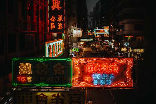 hong kong assorted lit kanji script LED signages on buildings during nighttime night